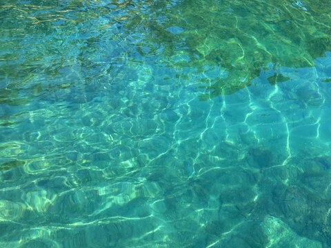 Emerald green sea water background.