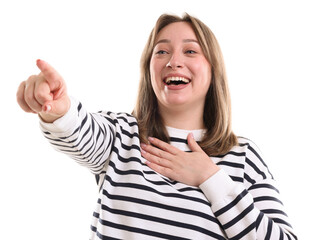 Attractive woman pointing at something and laughing on white background