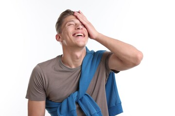 Handsome man laughing on white background. Positive emotion