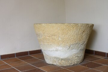 Ancient stone baptismal font in San Pelayo Church, Villarodrigo de la Vega, Palencia