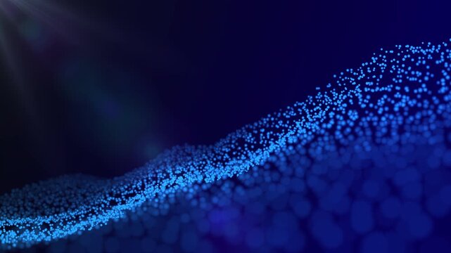 Vibrant blue particles create mesmerizing wave patterns in a dark environment