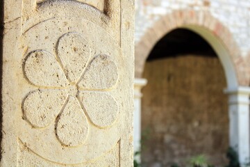At a column of the cloister of the Monastery of St. Francis in Pula