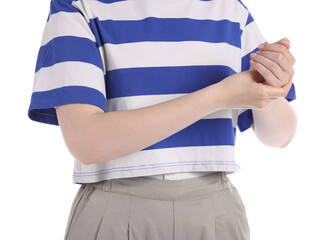 Young woman suffering from wrist pain on white background, closeup