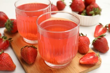 Tasty compot and strawberries on white table, closeup © New Africa