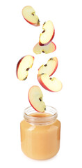 Baby food. Apple slices falling into jar of puree on white background