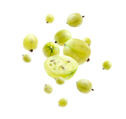 Fresh green gooseberries in air against white background