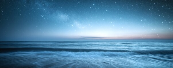 Fototapeta premium A serene seascape showcasing the ocean beneath a starry night sky