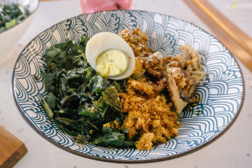 A tantalizing shot of a chicken teriyaki rice bowl, topped with a perfectly cooked egg. A vibrant...