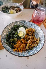 A tantalizing shot of a chicken teriyaki rice bowl, topped with a perfectly cooked egg. A vibrant...