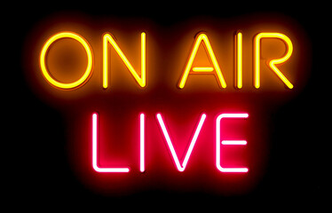 On air live glowing neon sign on a black background