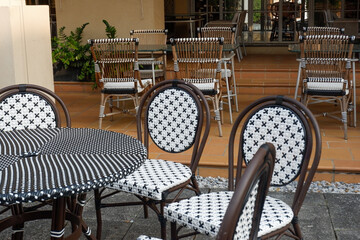 Classic white steel chair and table in the garden,empty white vintage chairs in the garden,decoration english garden concept.