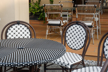 Classic white steel chair and table in the garden,empty white vintage chairs in the garden,decoration english garden concept.
