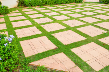 Walkway pathway s curve in public park,Lawn with curved paved garden path,Garden landscape design in flower garden,Selective focus,copy space.