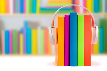 Books with headphones. Audiobook concept. Listening to lectures, learning languages, podcast,...