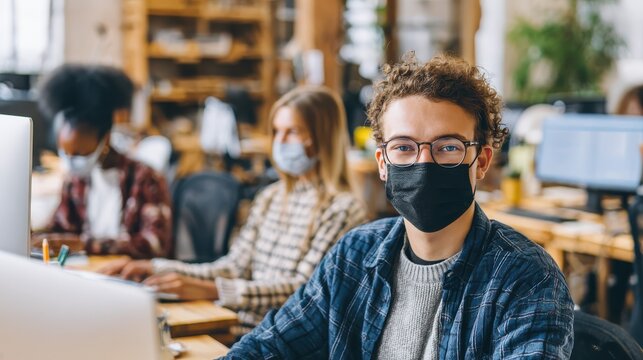 young people with face masks back at work or school in office after lockdown no logos no brands ar 169 - Powered by Adobe