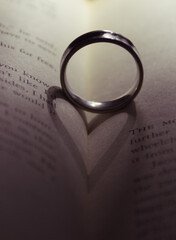 wedding rings on a book