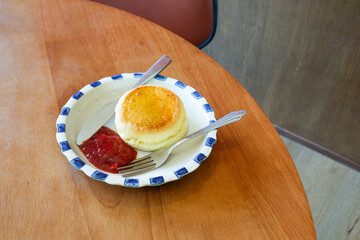 Healthy Matcha drink and Plate of Freshly baked scones served with butter and jam,Strawberry jam...