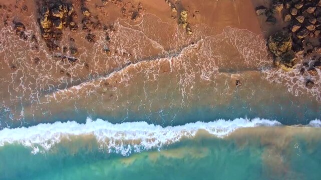 Drone shot of waves at the beach