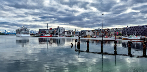 Tromso Harbor With Cruise Ship And Modern Buildings In Calm Fjord In Norway