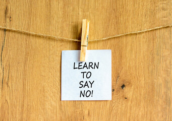 Learn to say no symbol. Concept words phrase Learn to say no on beautiful white paper on wooden...