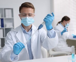 Medical analysis. Scientist working with sample in laboratory, selective focus