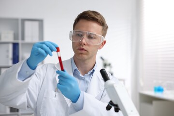 Medical analysis. Scientist working with blood sample in laboratory