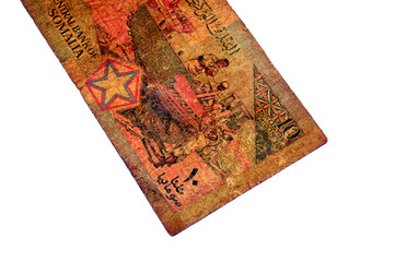 the reverse side of 10 SOS ten Somali Shilin Shillings cash money banknote, features Men building boats, by Central Bank of Somalia, vintage retro old Somali money