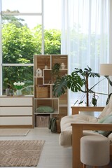 Stylish sofa and other furniture in living room. Interior design
