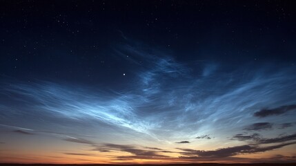 Fototapeta premium Noctilucent clouds light up the twilight sky, landscape background for astronomy