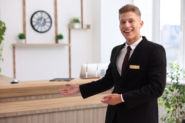 Portrait of smiling receptionist welcoming in hotel
