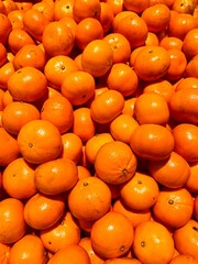A pile of mandarin oranges, often also called Clement Gold, is displayed at a fruit market in Indonesia.