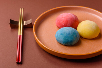 Japanese mochi, ice cream or Asian sweets with fruit filling. Mochi of different colors