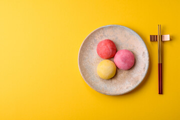 Japanese mochi, ice cream or Asian sweets with fruit filling. Mochi of different colors