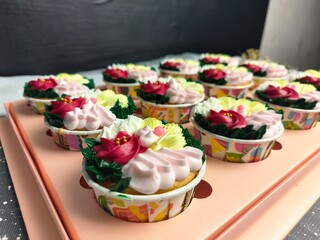 cupcake with colorful flower-shaped butter cream
