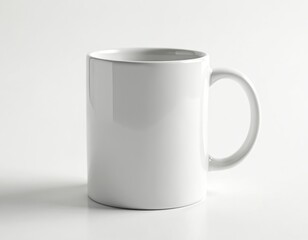 Obraz premium Blank white ceramic mug on clean isolated background. Simple studio shot perfect for custom printing, branding, or product presentation. Ideal for showcasing designs for tea, coffee, hot beverages.