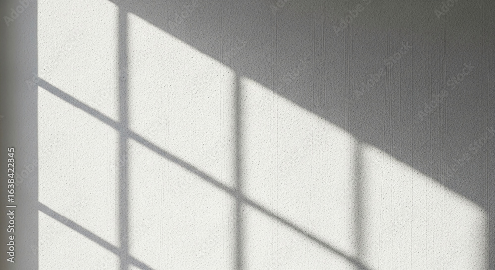 Poster white textured wall with window shadow patterns, creating a minimalist and clean aesthetic, ideal fo