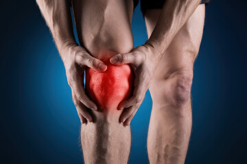 Knee Pain Illustration with Hands Holding Knee and Red Highlight on Joint Against Blue Gradient Background
