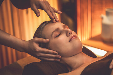 Caucasian woman enjoying relaxing anti-stress head massage and pampering facial beauty skin...