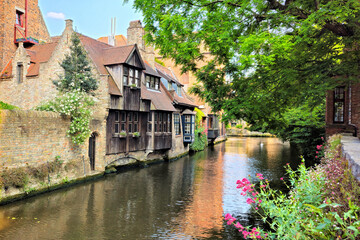 Beautiful old houses lining the tranquil canals of Bruges, Belgium