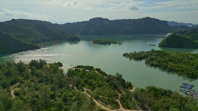 Aerial view of isles with lush greenery contrasting with the turquoise waters, creating a serene landscape, Langkawi Island, Kedah, Malaysia.
