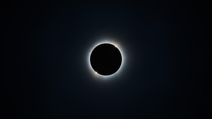 Total Solar Eclipse Corona With Diamond Ring Effect Against Dark Sky moon