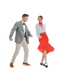 Happy couple in retro outfits dancing on white background