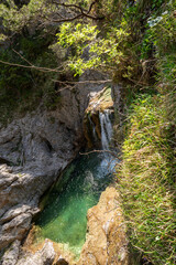 View over the small Stuiben Falls on a sunny day, reutte, Austria. Small waterfalls in beautiful...