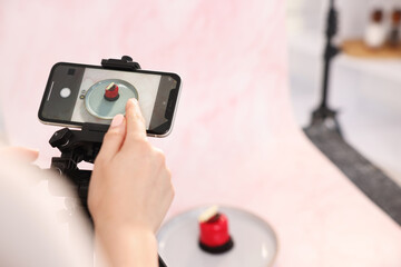 Woman taking picture of tasty dessert in studio, selective focus. Professional food photography