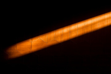 Dramatic Light Beam on Hexagonal Wood Paneling:  Abstract Texture Background