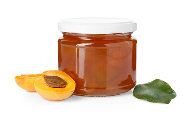 Tasty apricot jam in jar, fresh fruit and green leaf isolated on white
