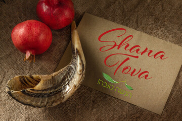 Rosh Hashanah. Shofar and  pomegranate on sacking. Gift card
