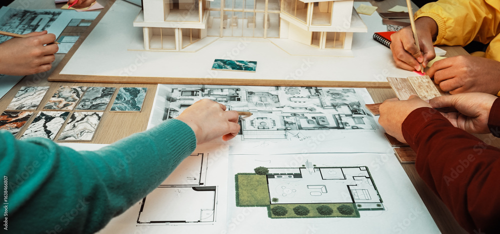 Poster a dynamic scene of a collaborative design session where individuals engage with architectural models