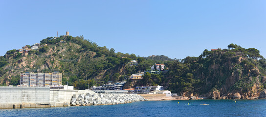 Panoramic view towards Blanes port location from the sea, Catalonia.