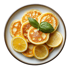 Delicious lemon pancakes on a plate garnished with basil